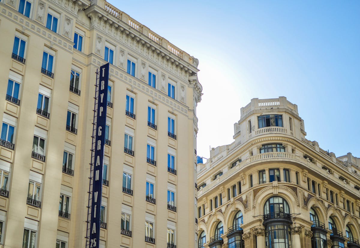 Things to Do in Madrid: The Ultimate Guide to Madrid's Best Attractions & Activities 9 Gran Via street in Madrid with classic urban architecture under clear skies