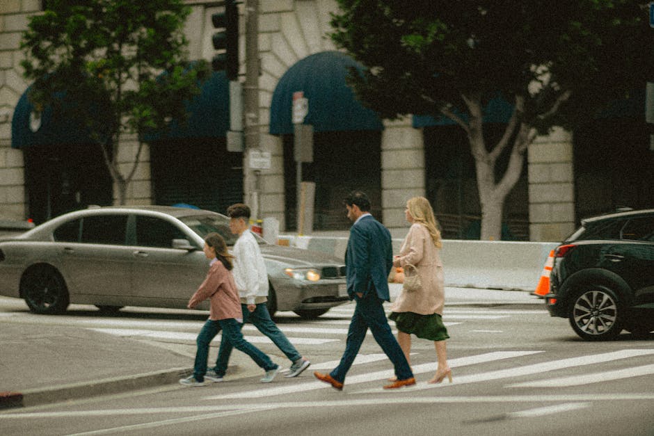 Family crossing a city street together
