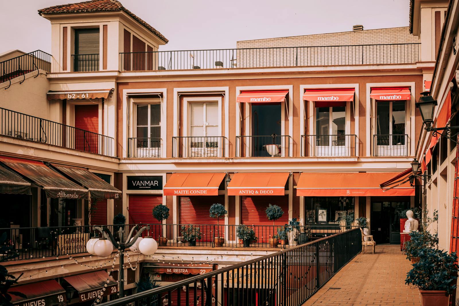 Traditional courtyard with colorful awnings in La Latina neighborhood Madrid