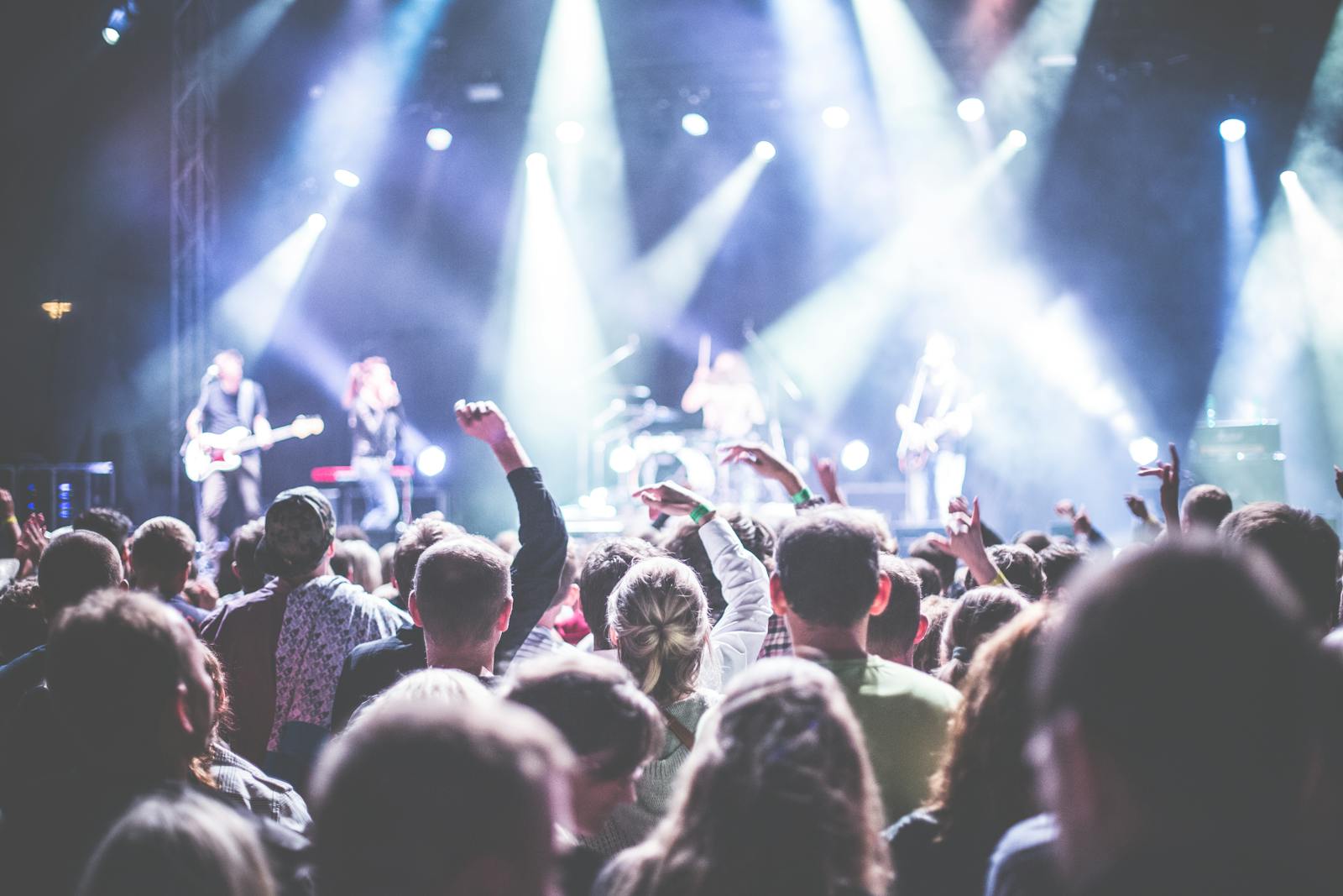 Energetic live music concert with audience and band performing