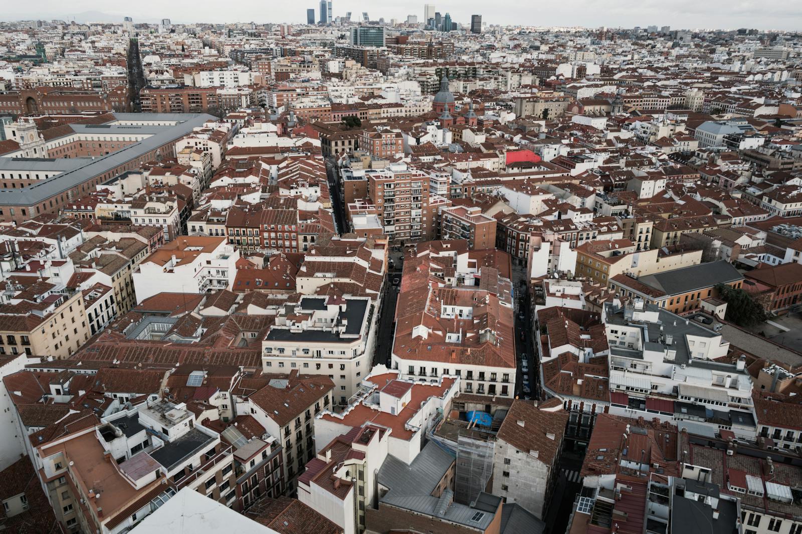 Aerial view of Madrid red-tiled rooftops and dense urban neighborhoods