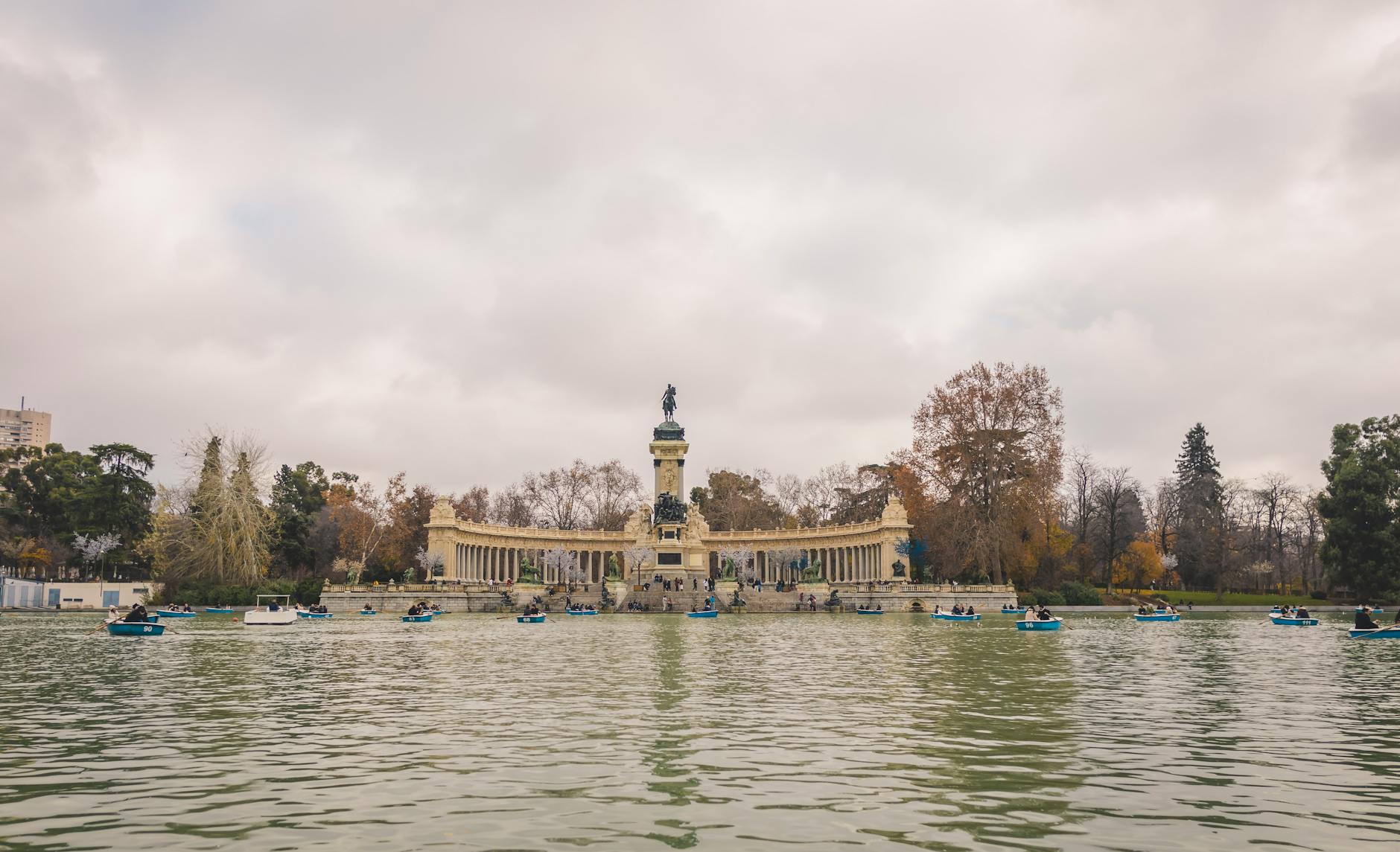 Retiro Park lake with rowing boats in Madrid Spain
