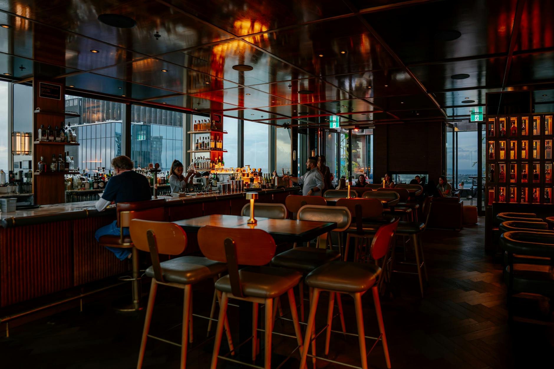 Rooftop bar with city skyline views at night