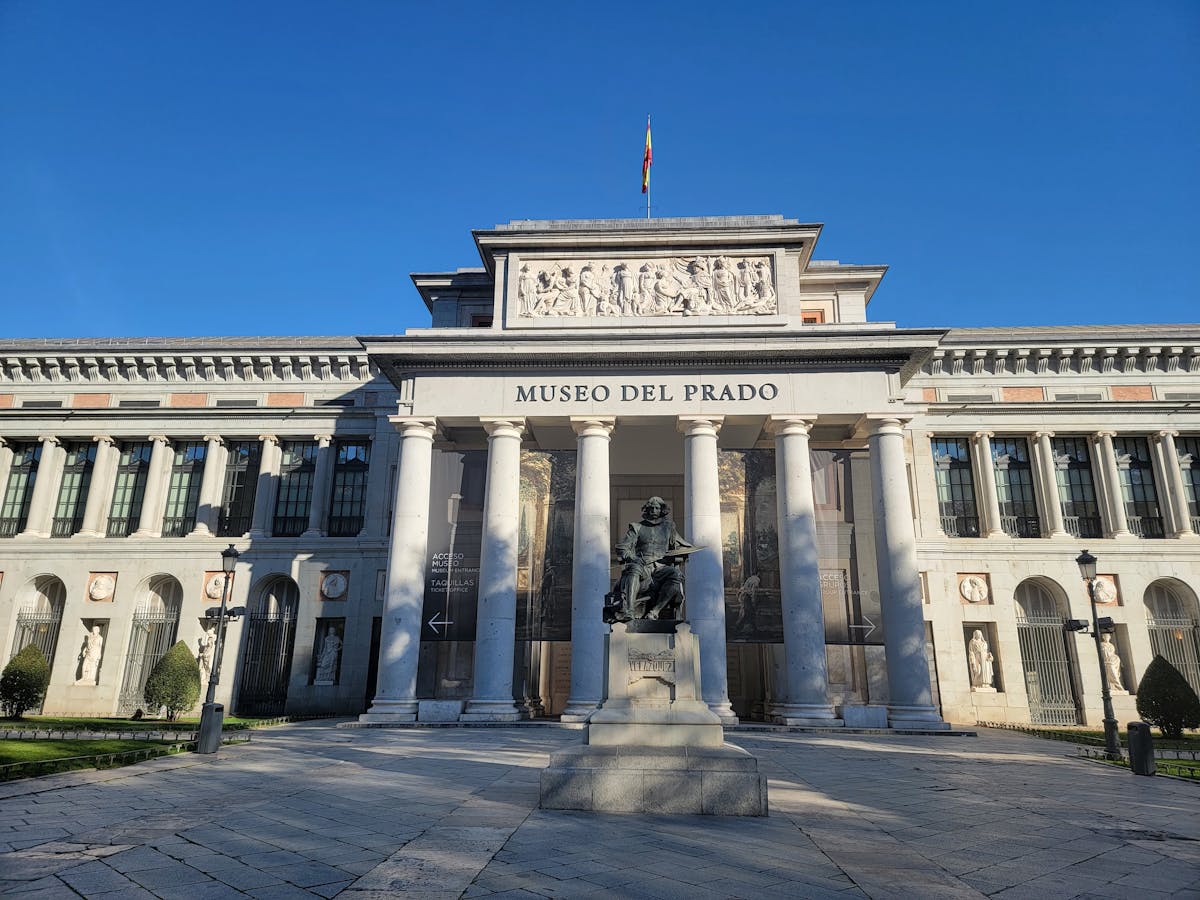 Things to Do in Madrid: The Ultimate Guide to Madrid's Best Attractions & Activities 3 Prado Museum iconic neoclassical facade under blue skies in Madrid