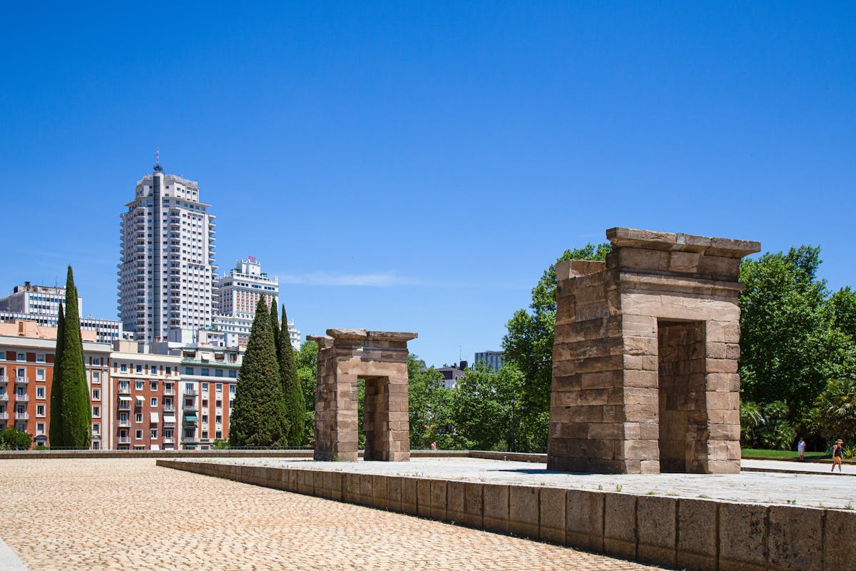 Things to Do in Madrid: The Ultimate Guide to Madrid's Best Attractions & Activities 7 Ancient Temple of Debod in Madrid with modern cityscape background
