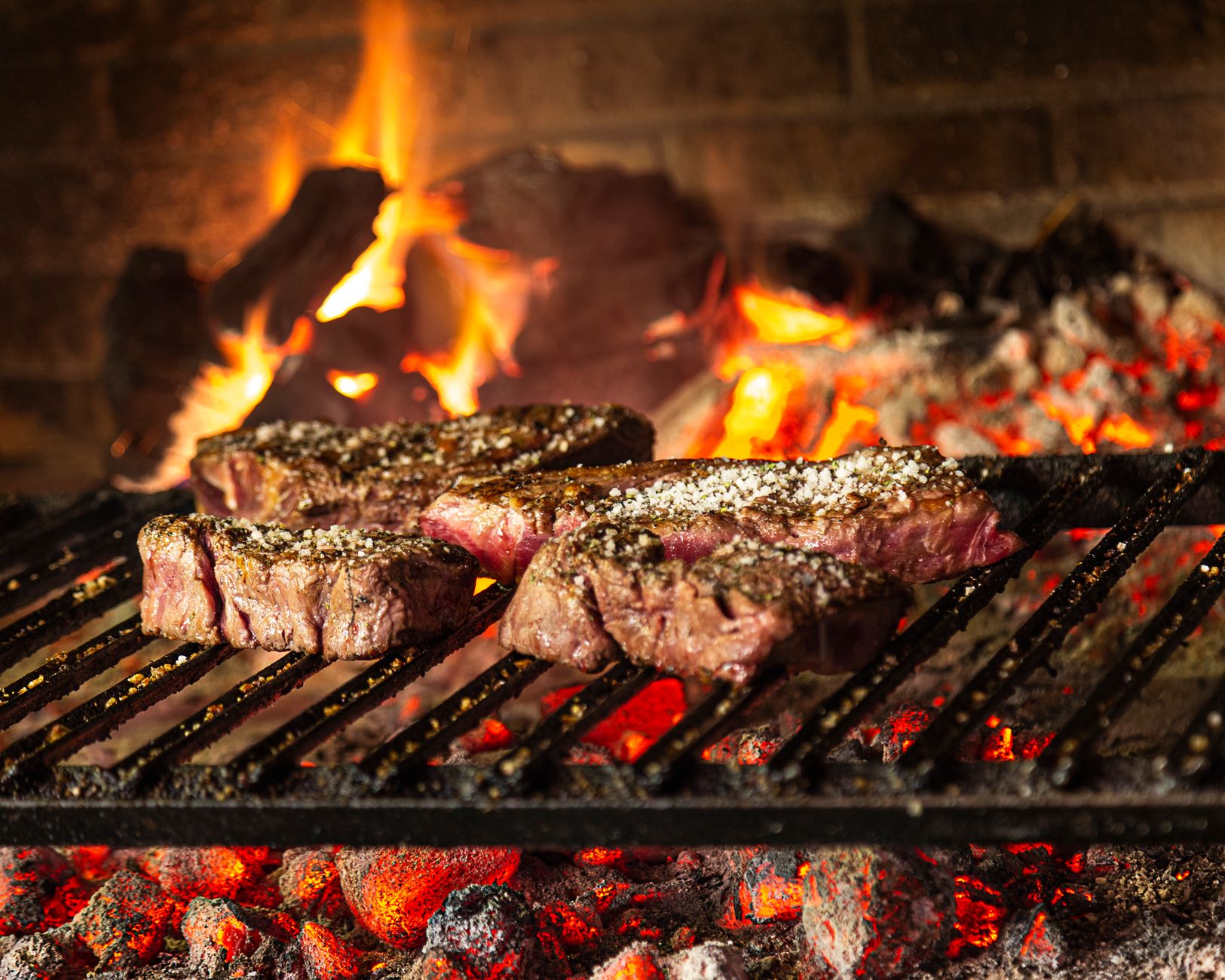 Ávila Spain Day Trip from Madrid: Best Walls Guide 2026 4 Chuletón de Ávila massive T-bone steak sizzling on a cast iron plate
