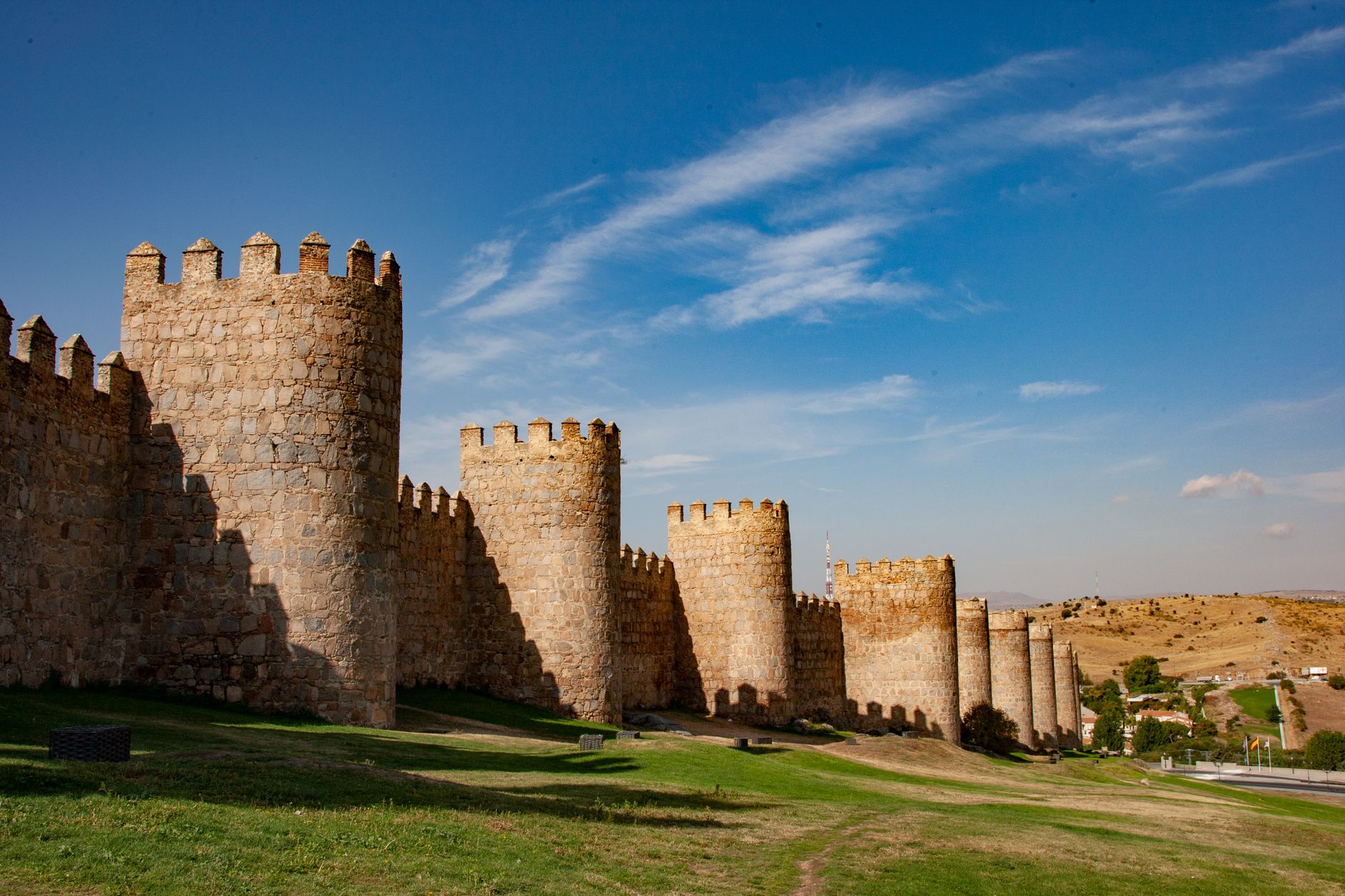 Ávila Spain Day Trip from Madrid: Best Walls Guide 2026 3 Ávila Spain medieval city walls illuminated at dusk with watchtowers