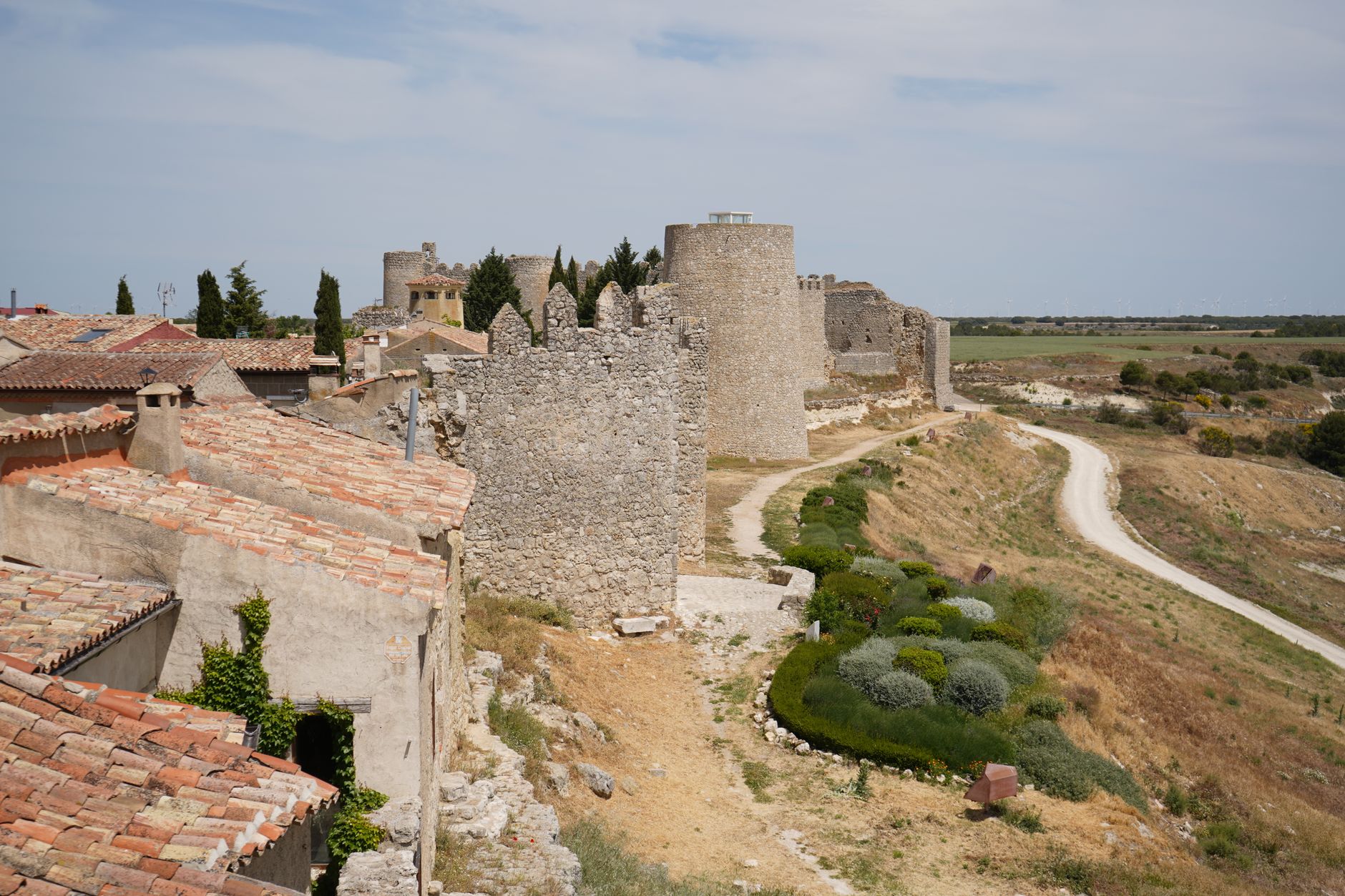 Buitrago del Lozoya Day Trip: Best Hidden Gem Guide 2026 5 Buitrago del Lozoya medieval stone walls and towers reflected in the Lozoya reservoir