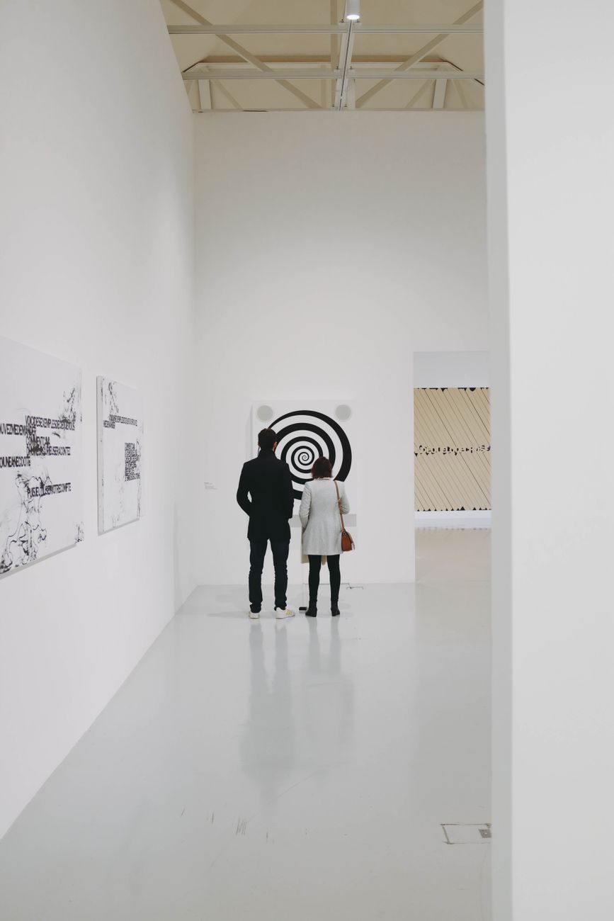 Art Galleries Madrid Contemporary: Best 10 Picks 2026 4 Visitors browse contemporary artworks in a white-walled Madrid gallery space