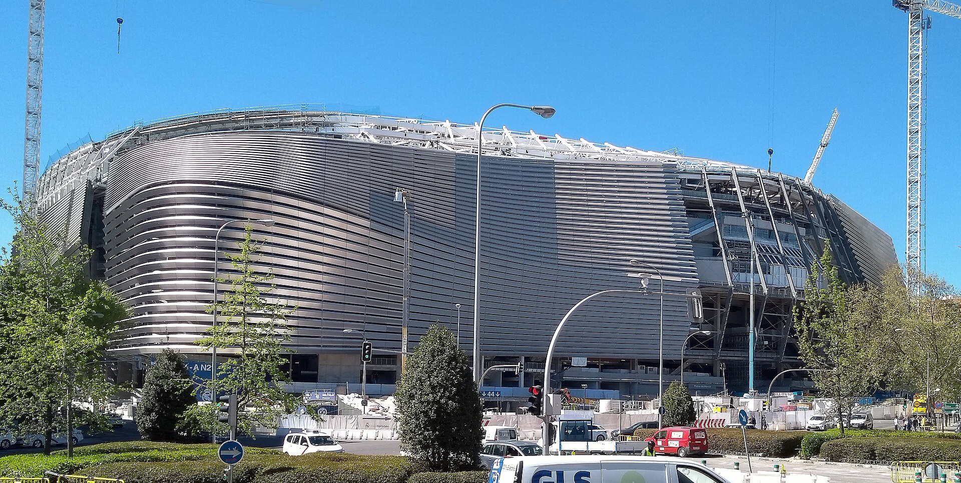 Football in Madrid: Bernabéu, Metropolitano and How to Get to a Match 2 The Santiago Bernabéu wrapped in its new curved steel façade, with construction cranes still standing beside it and traffic on the street in front